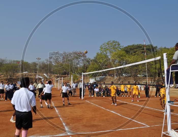 Players Playing Volleyball At a Court