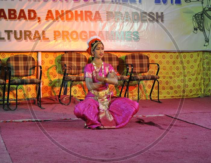 A Woman performing classical dance on the dais