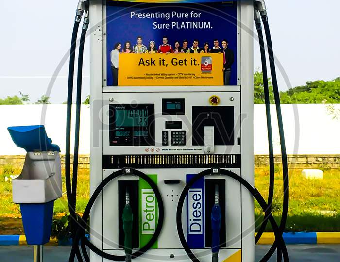 fuel dispenser machine at Bharat petroleum showing increased petrol prices