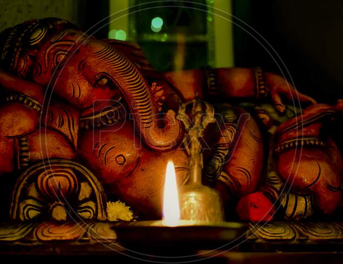 Sleeping Ganesha and the Oil Lamp