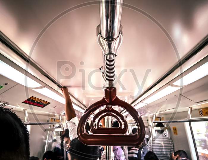 Handle Bars in an Metro Train