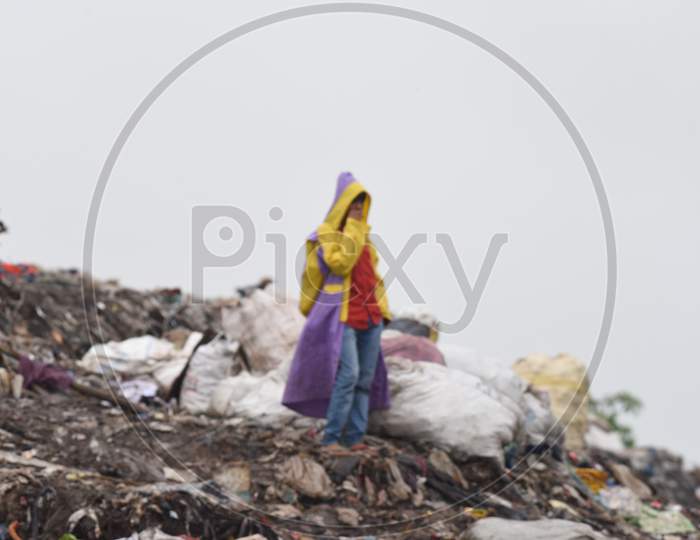 Indian  Rag Pickers in  Dumping Ground Or Yard in Guwahati