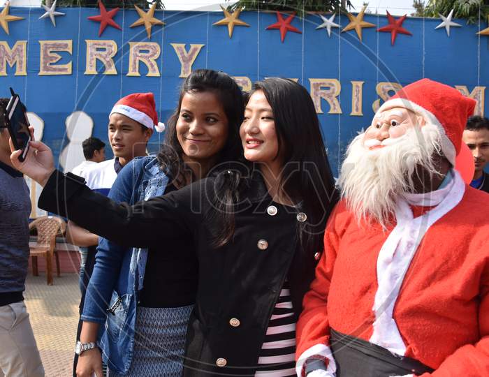 Indian Girls  Taking Selfies At Church During  Christmas  Celebrations in Guwahati