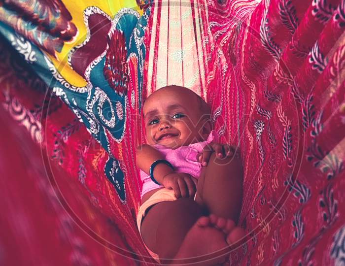 Infant Baby In an Saree Swing