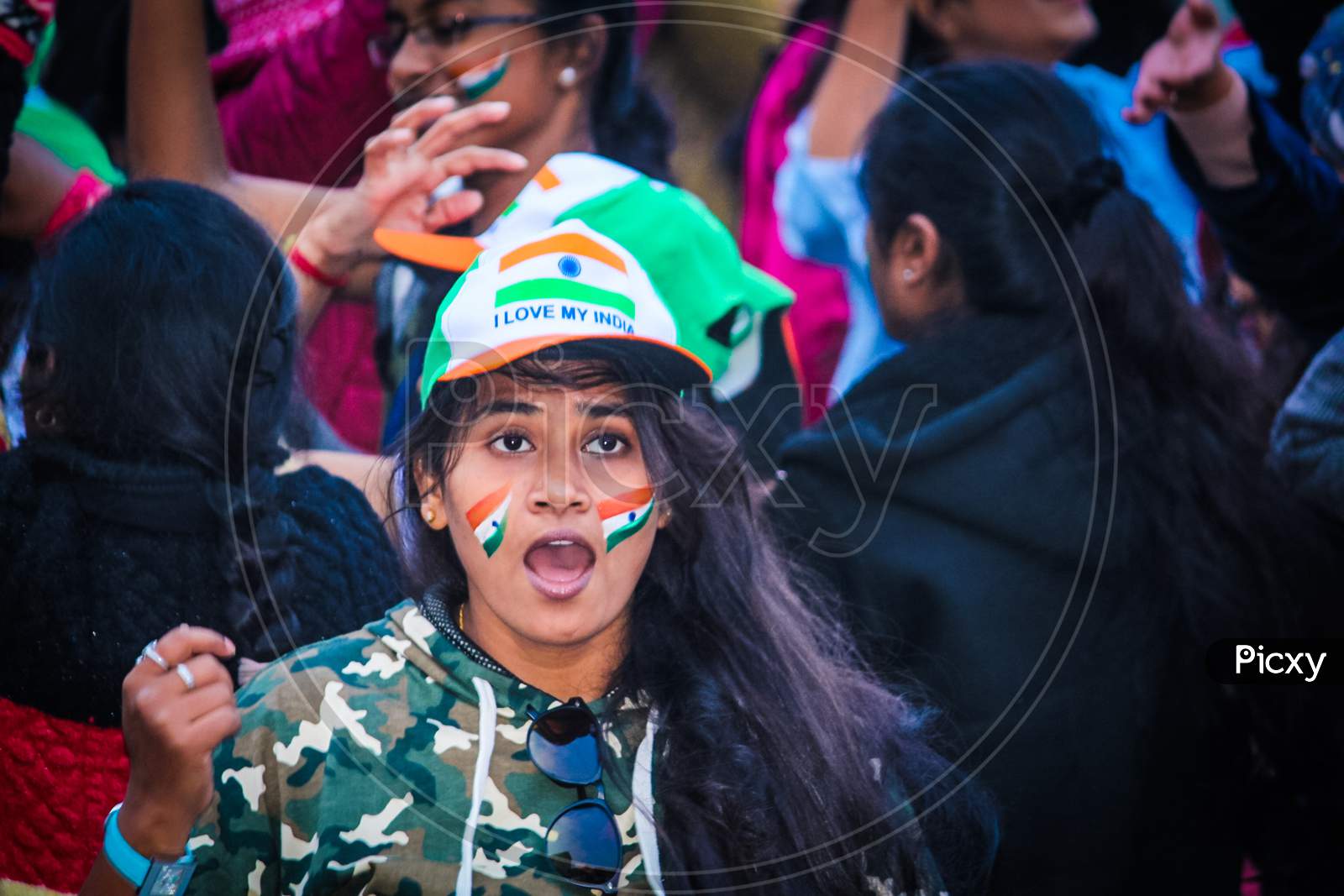 Indian Woman With Indian National Flag Stickers At Independence Day Parade
