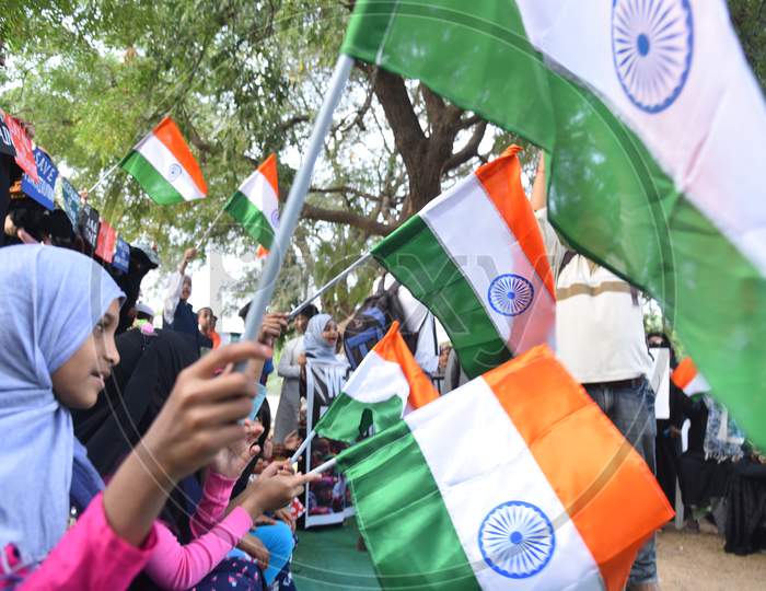 Muslim women hold Indian Flags at an all women protest against CAA and NRC on 27th December 2019