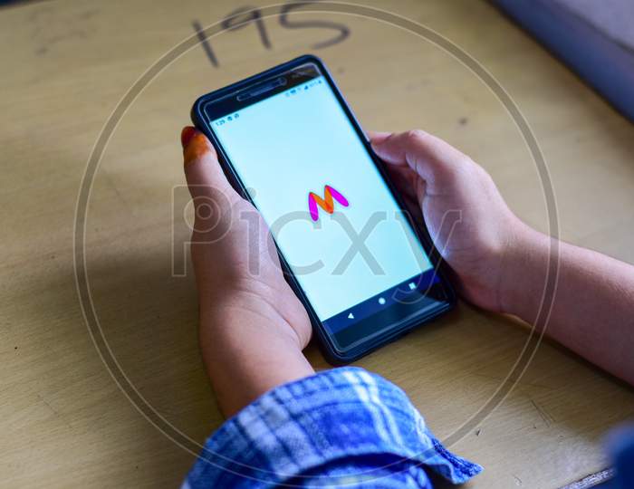 Man Using Myntra App In Smartphone  Closeup