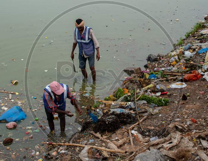 GHMC Sanitary Workers Cleaning Hussain Sagar Lake At Tank Bund, Hyderabad