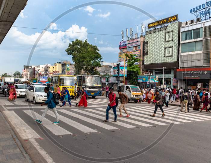 Pedestrians At  Zebra Crossing  In an Urban City Traffic Signal