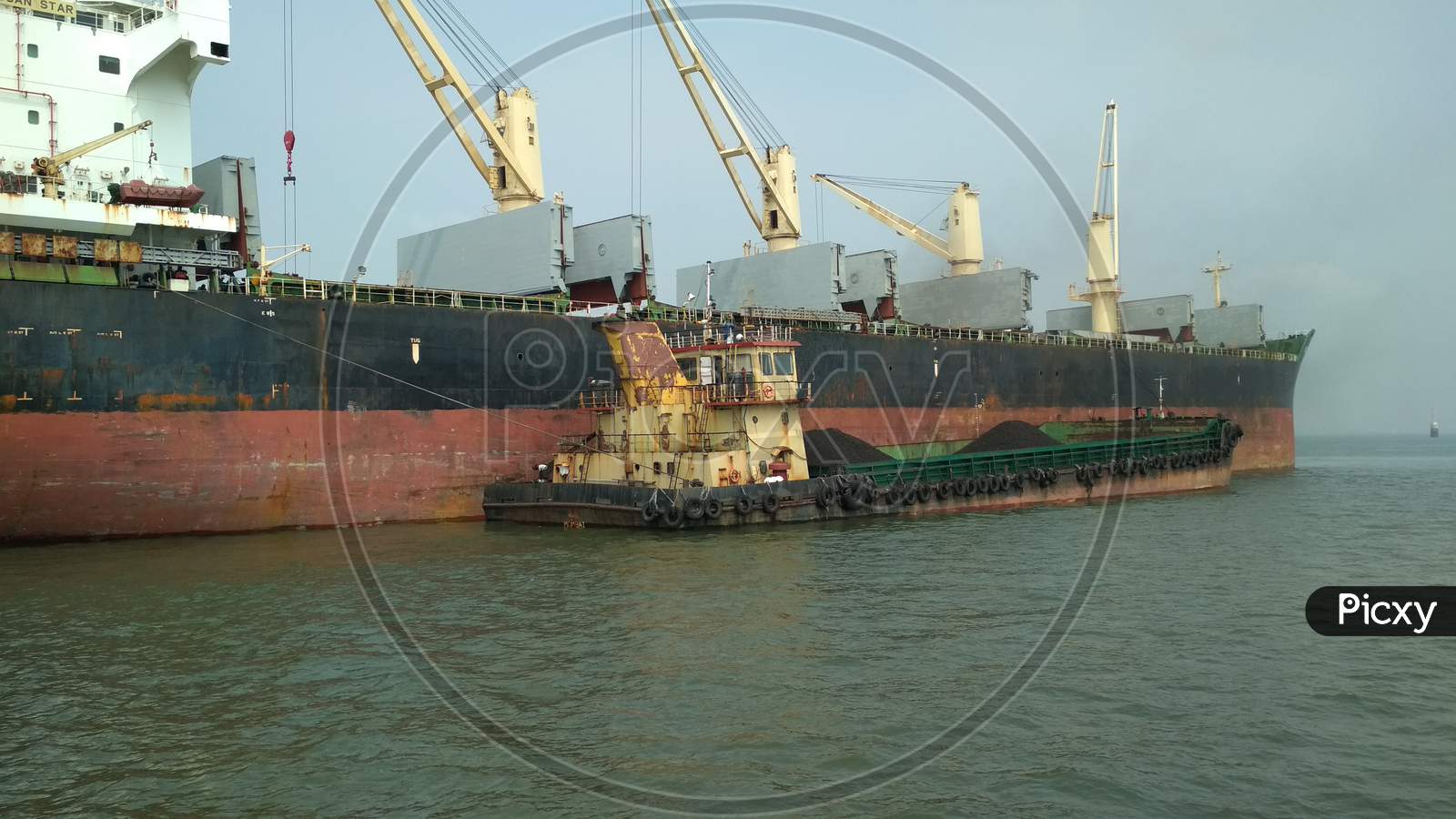 unloading of coal from a Container Ship, Mumbai Port