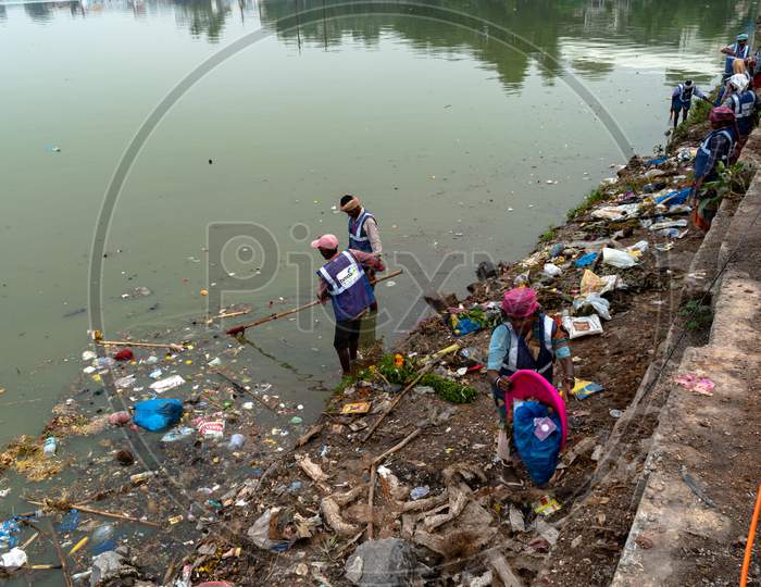 GHMC Sanitary Workers Cleaning Hussain Sagar Lake At Tank Bund, Hyderabad