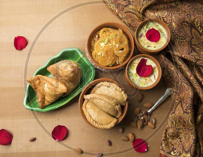 Indian Maharashtrian Festival Food for Holi. Puranpoli, Sweet roti,Gulpoli , Samosa And Badam Kheer With Dry Fruits Bowl