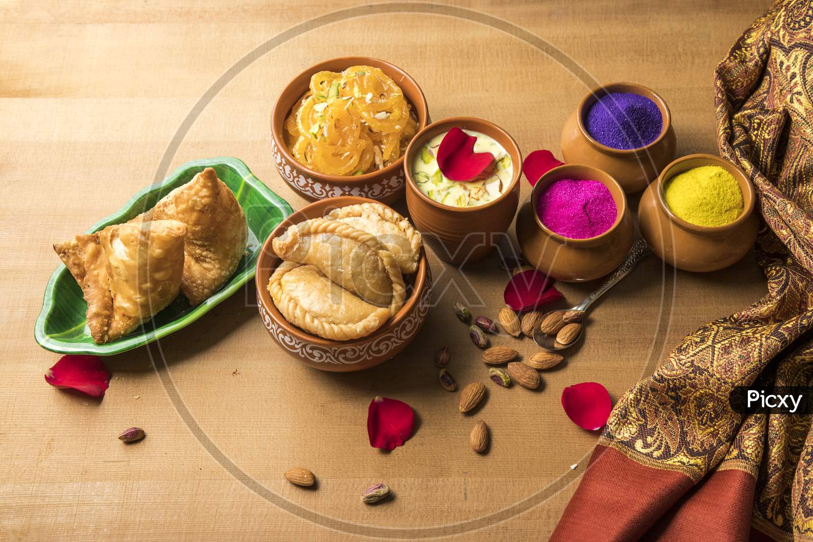 Indian Maharashtrian Festival Food for Holi. Puranpoli, Sweet roti,Gulpoli , Samosa  And Badam Kheer With Dry Fruits Bowl