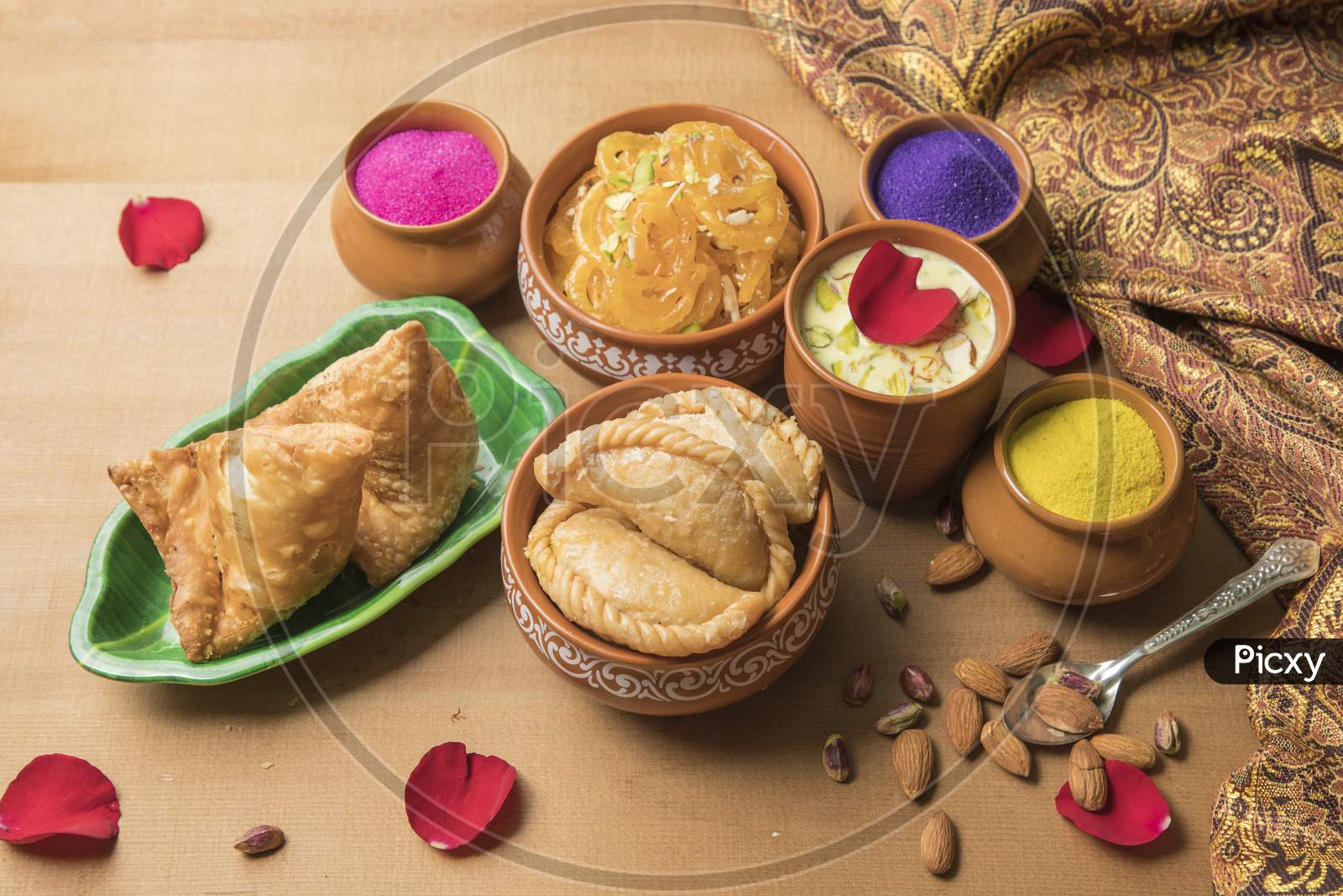 Indian Maharashtrian Festival Food for Holi. Puranpoli, Sweet roti,Gulpoli , Samosa And Badam Kheer With Dry Fruits Bowl