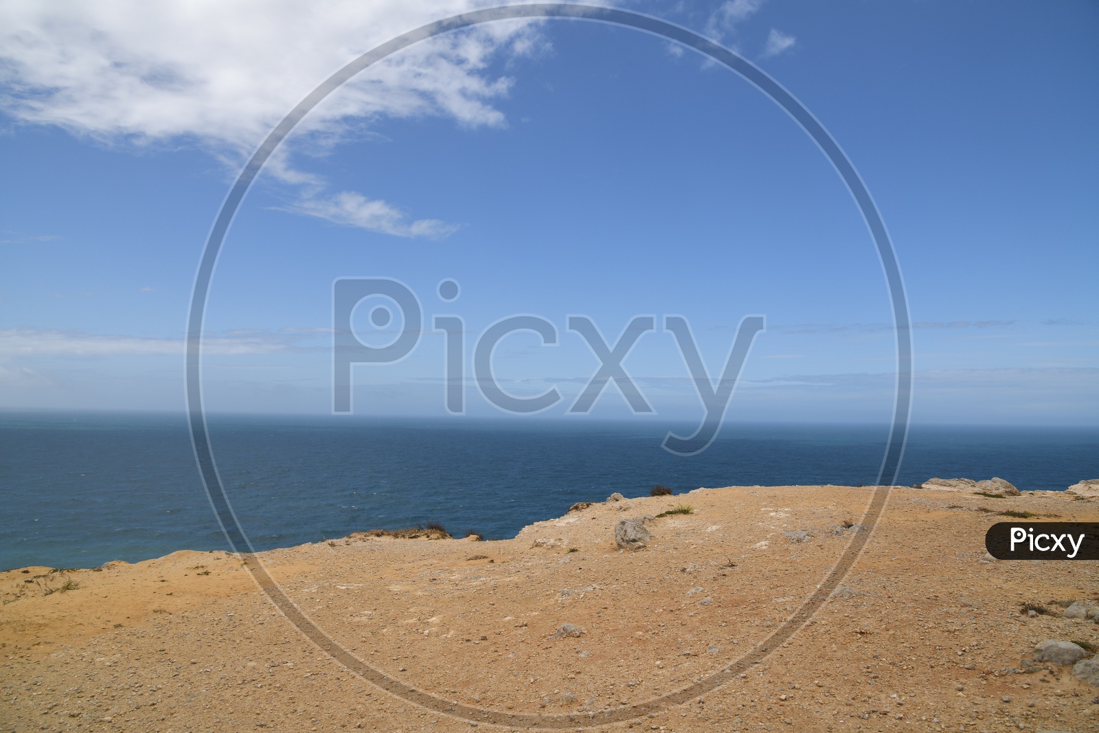 Sea Coast With Hill And Sky Background