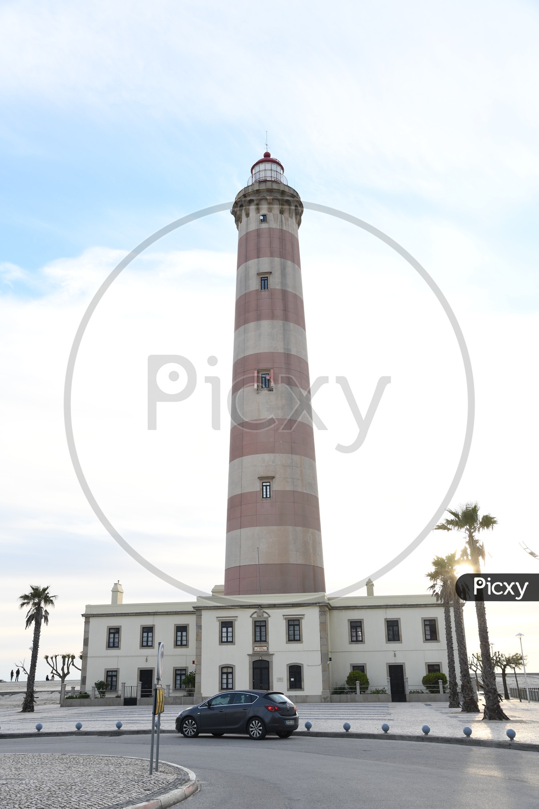 Lighthouse With  Blue Sky Background