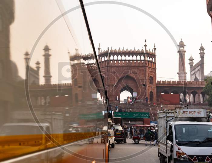 Reflection of Jama Masjid on a bus