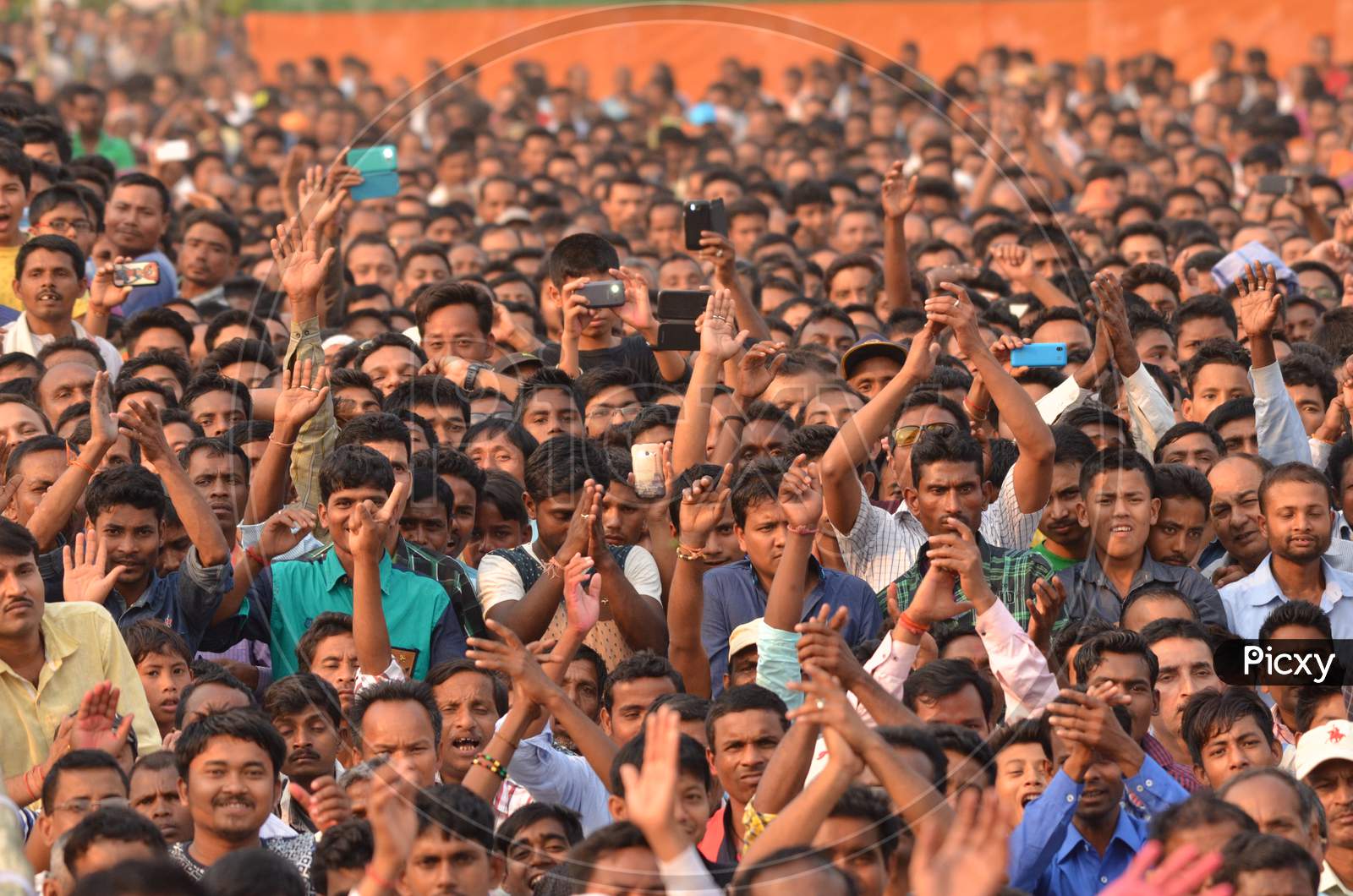 Image of Crowd of Young Indian Cheering and Recording With Smartphones ...