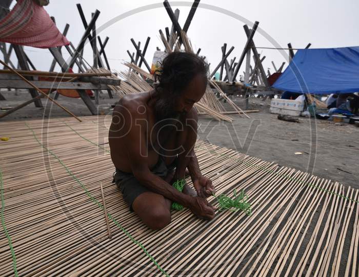 Artisan Making Bamboo Crafts  With Bamboo Woods in Bamboo Market On Bramhaputra River Bank In Guwahati