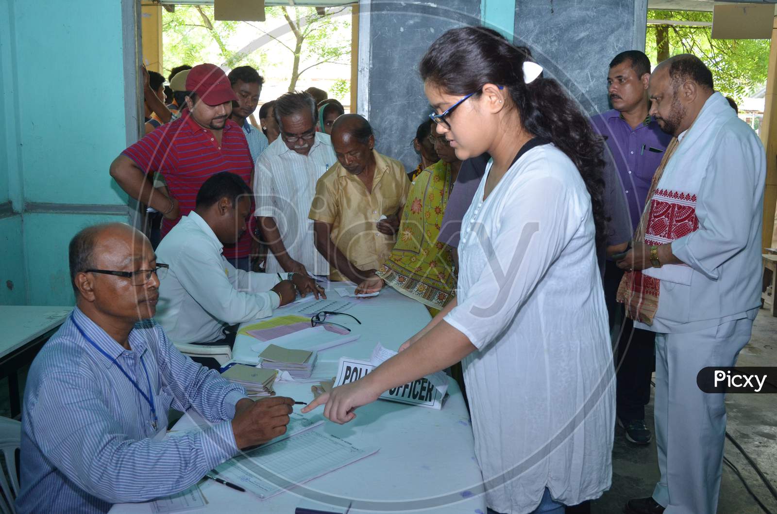Indian Voters Casting Their Votes in Assembly General Elections At a Polling Booth