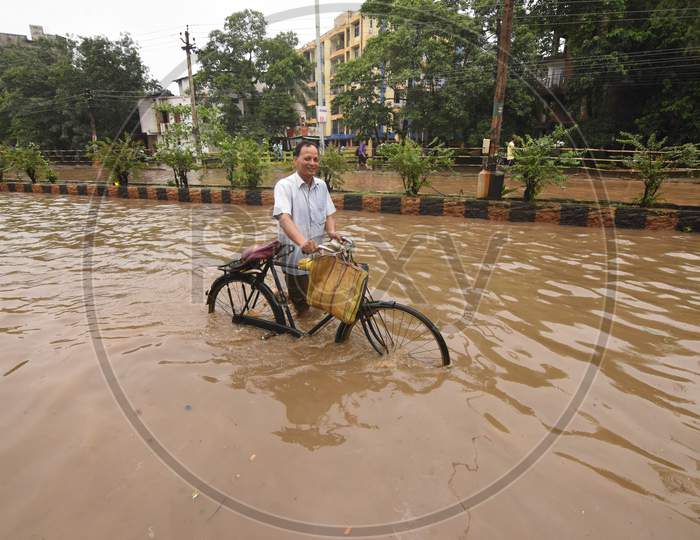 People Of Guwahati On Flooded Roads Due To Seasonal Floods In Assam People Of Guwahati On Flooded Roads Due To Seasonal Floods In Assam