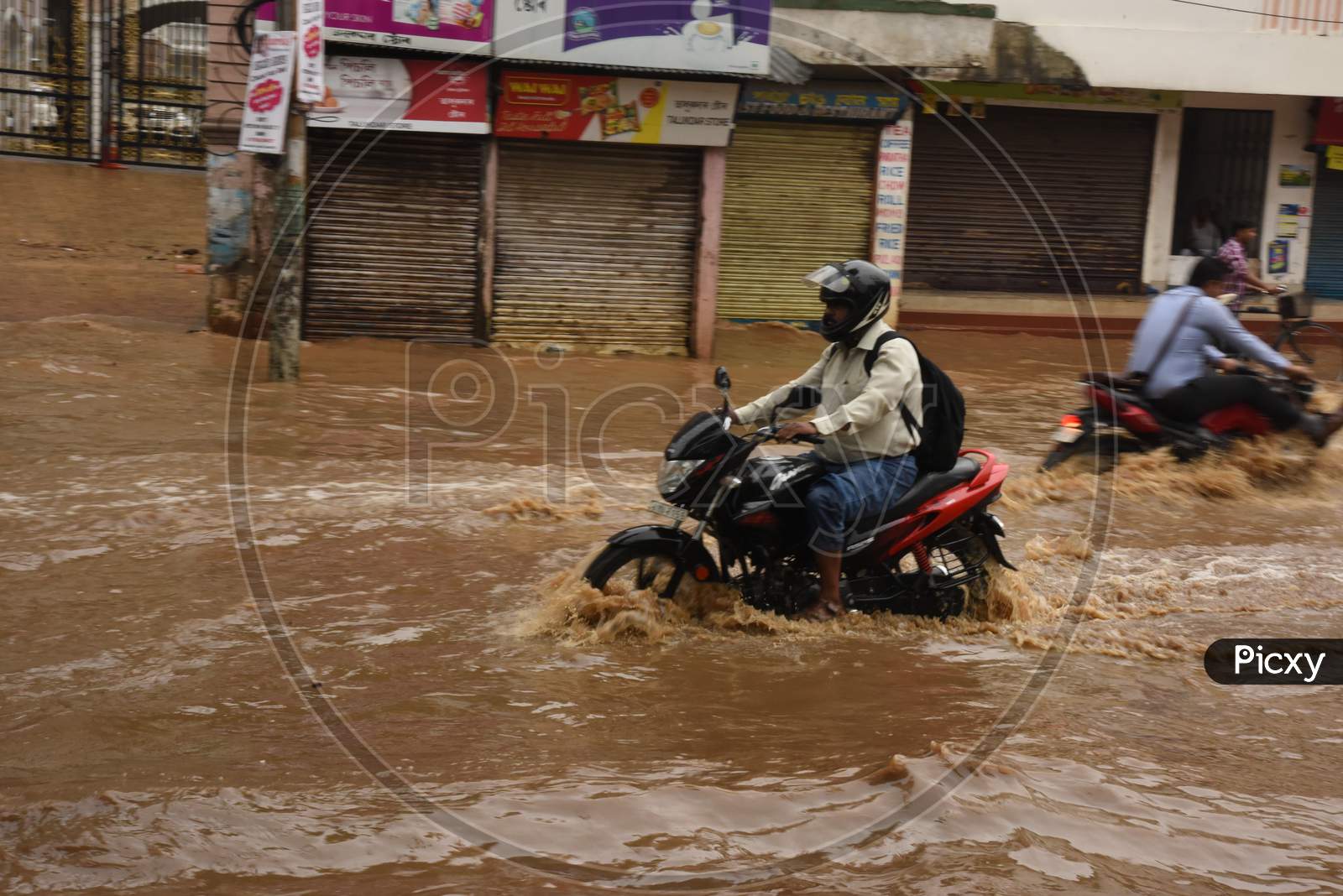 Commuters on Flooded Roads Due To Seasonal Floods in Guwahatti City , Assam