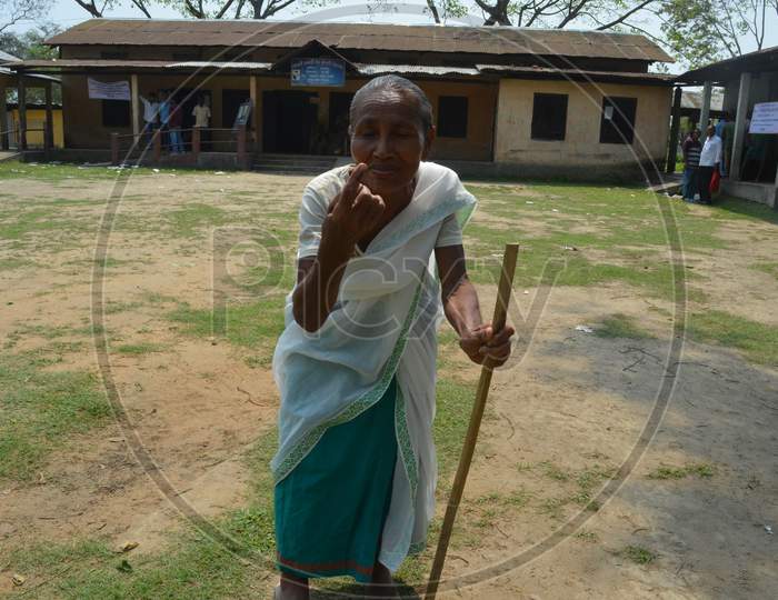 An Elderly Woman Showing Inked Finger After Casting Vote In  Assam Assembly General Elections 2016