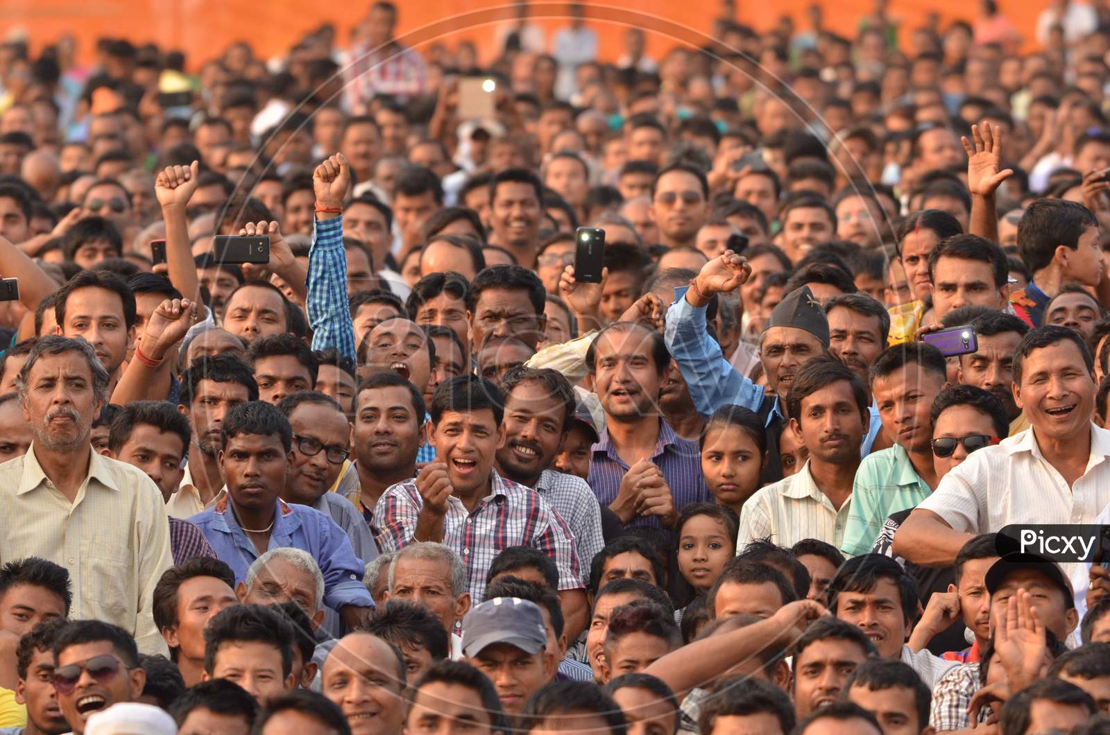Crowd of Young Indian Cheering and Recording With Smartphones At Prime Minister Narendra Modi Political Meeting In Assam