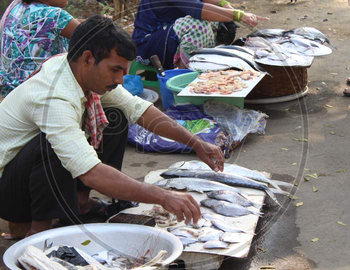 A Fish Vendor  In a Market