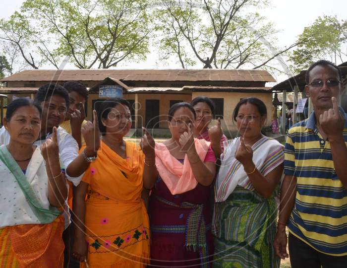 Assamese  Bodo Tribe Woman Showing inked Finger After Casting Their Vote In Assam Assembly Elections 2016