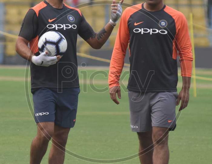 Team India Captain  Virat Kohli  And M.S Dhoni Plays Football During A Practice Session Ahead Of The First One Day International Cricket Match Against West Indies, At Aca Cricket Stadium, Barsapara In Guwahati