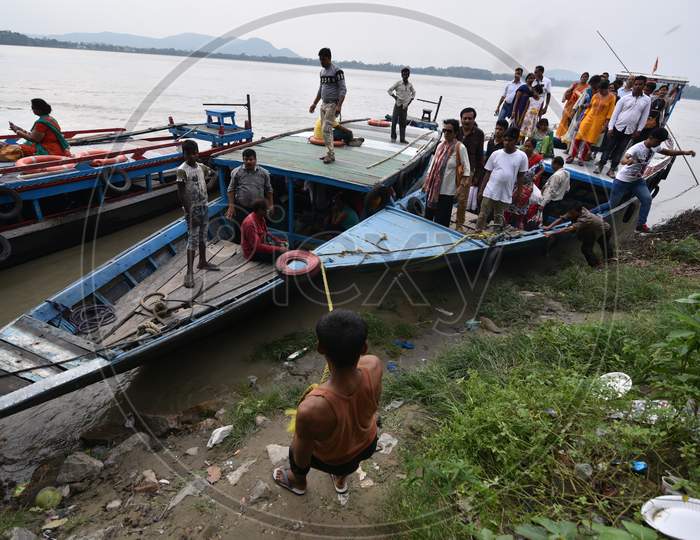 People of Guwahati and Surrounding Villages Commuting on Boats Over  Bramahaputra River As a Part Of Their Daily Life Style