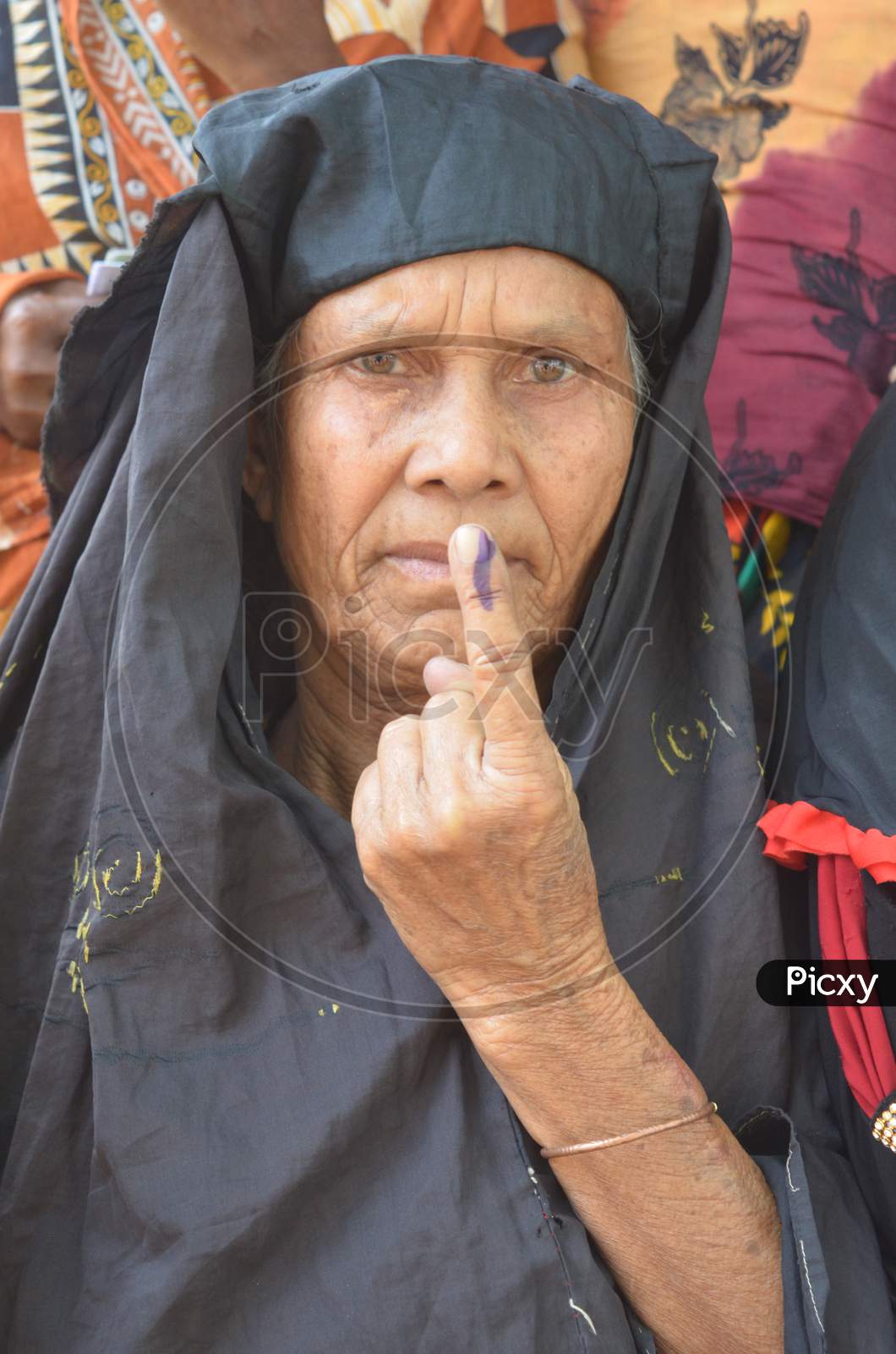Muslim Woman Showing  Inked Finger After Casting Vote in Assam Assembly Elections 2016
