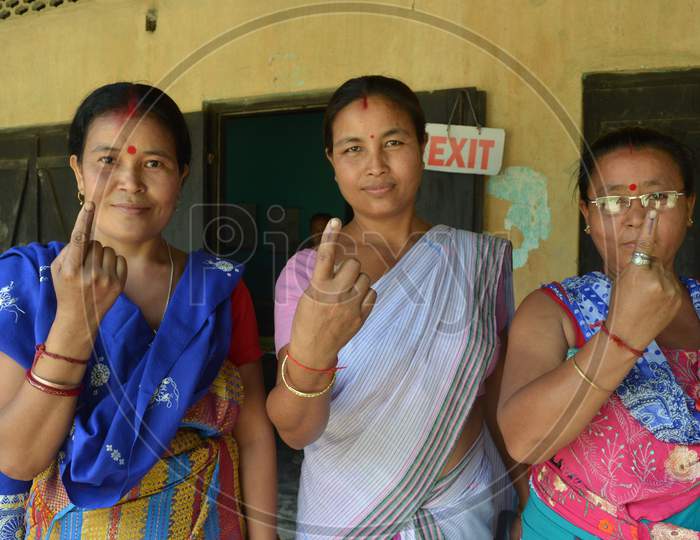 Image Of Assamese Bodo Tribal Woman Showing Inked Finger After Casting Their Vote In Assam