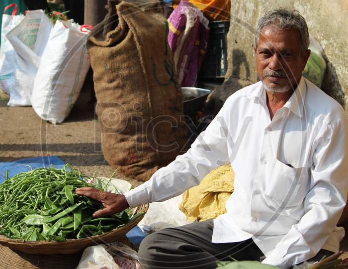 Portrait Of a Vegetable Vendor in an Market