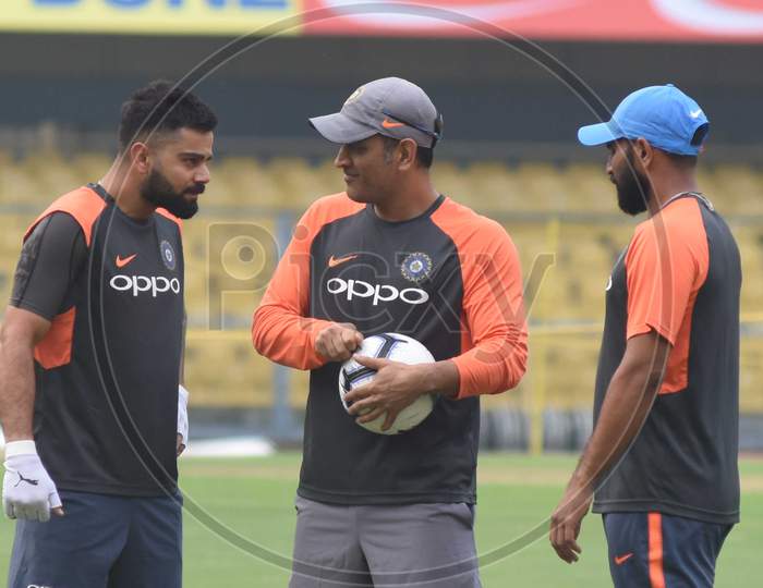 Team India Captain  Virat Kohli  And M.S Dhoni Plays Football During A Practice Session Ahead Of The First One Day International Cricket Match Against West Indies, At Aca Cricket Stadium, Barsapara In Guwahati