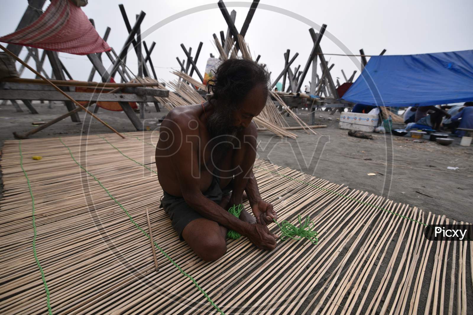 Artisan Making Bamboo Crafts  With Bamboo Woods in Bamboo Market On Bramhaputra River Bank In Guwahati