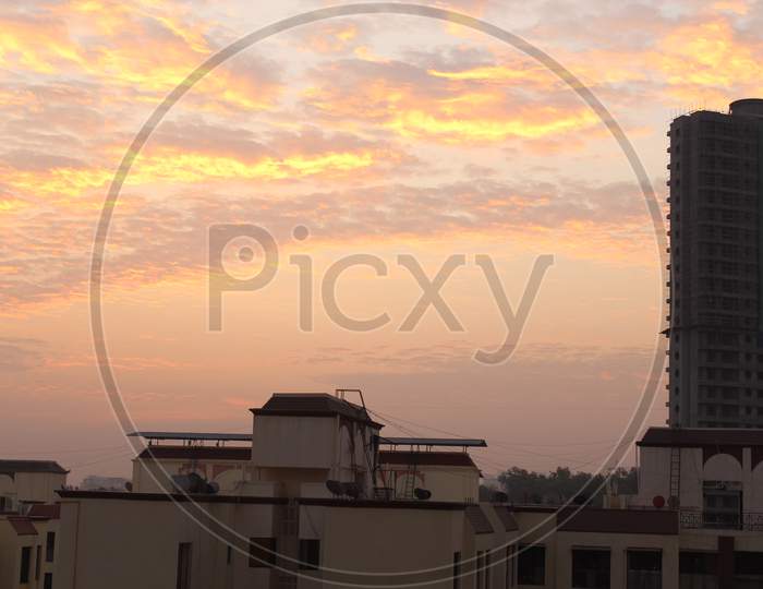 Golden Sunset Sky Over Residential Apartments