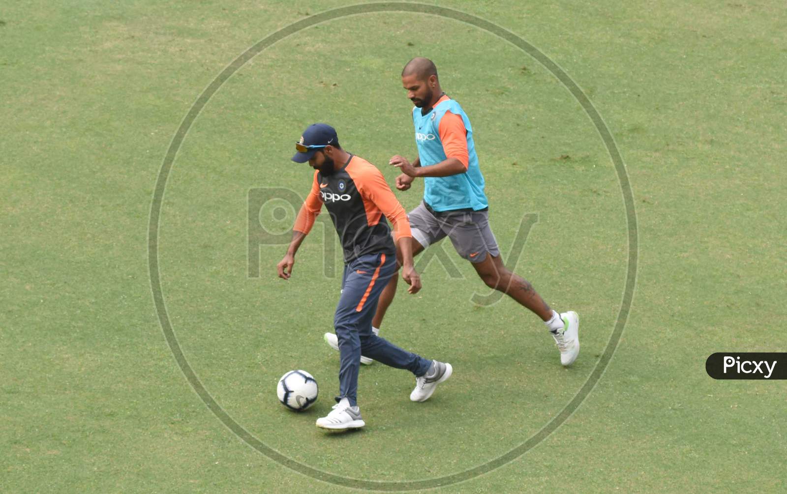 Team India Captain  Virat Kohli  And Sekhar Dhawan Plays Football During A Practice Session Ahead Of The First One Day International Cricket Match Against West Indies, At Aca Cricket Stadium, Barsapara In Guwahati