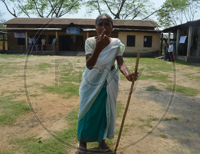 An Elderly Woman Showing Inked Finger After Casting Vote In  Assam Assembly General Elections 2016