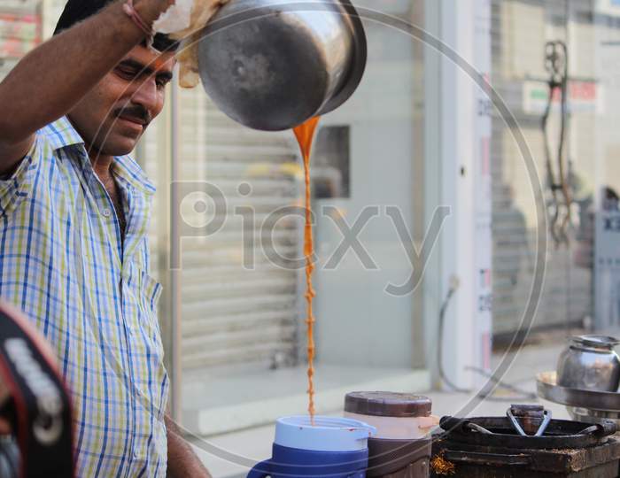 A Tea Vendor At a Stall