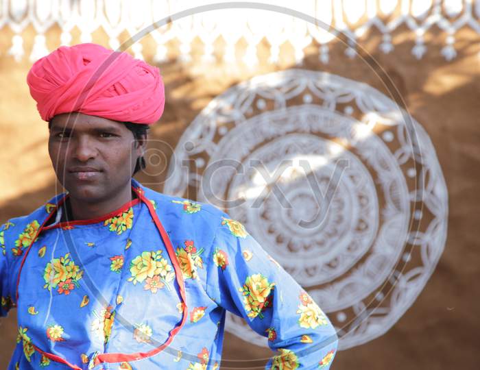 Young Rajasthani Man in Traditional Attire at Shilpgram Fair, Udaipur, Rajasthan