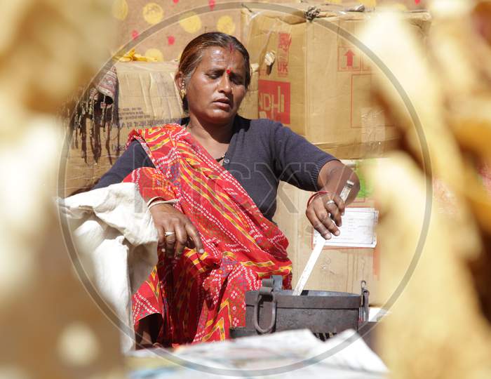 Rajasthani Woman Making Roti's in Shilpgram Fair, Udaipur, Rajasthan