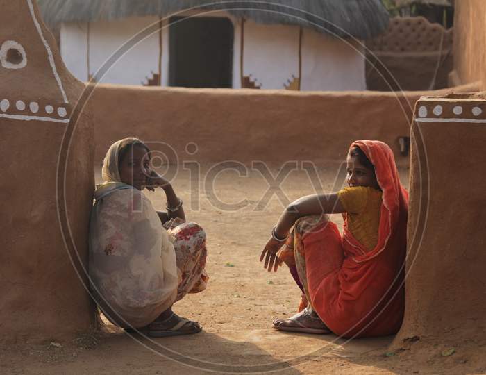Rajasthani Women sat outside a House
