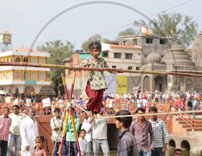Small Girl walking on Rope in Kumbh Mela, Ujjain, Madhya Pradesh