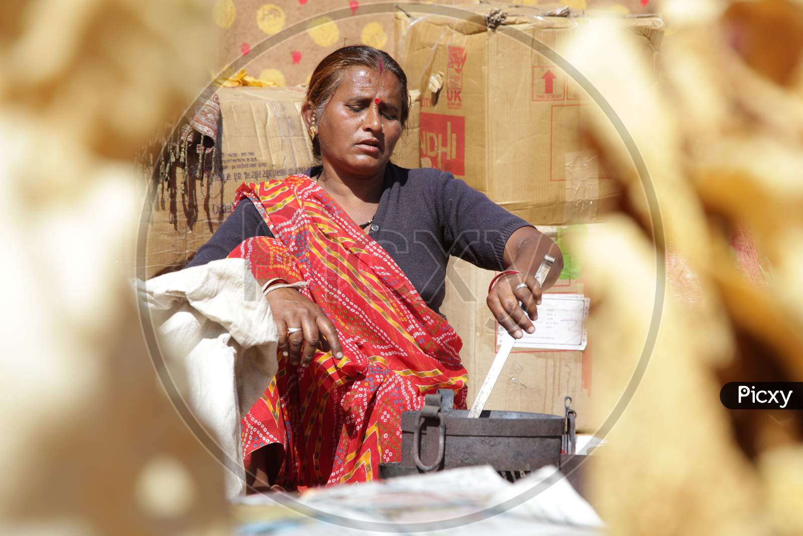 Rajasthani Woman Making Roti's in Shilpgram Fair, Udaipur, Rajasthan