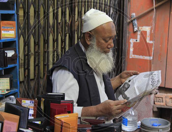 Indian Old Muslim Man Reading Newspaper