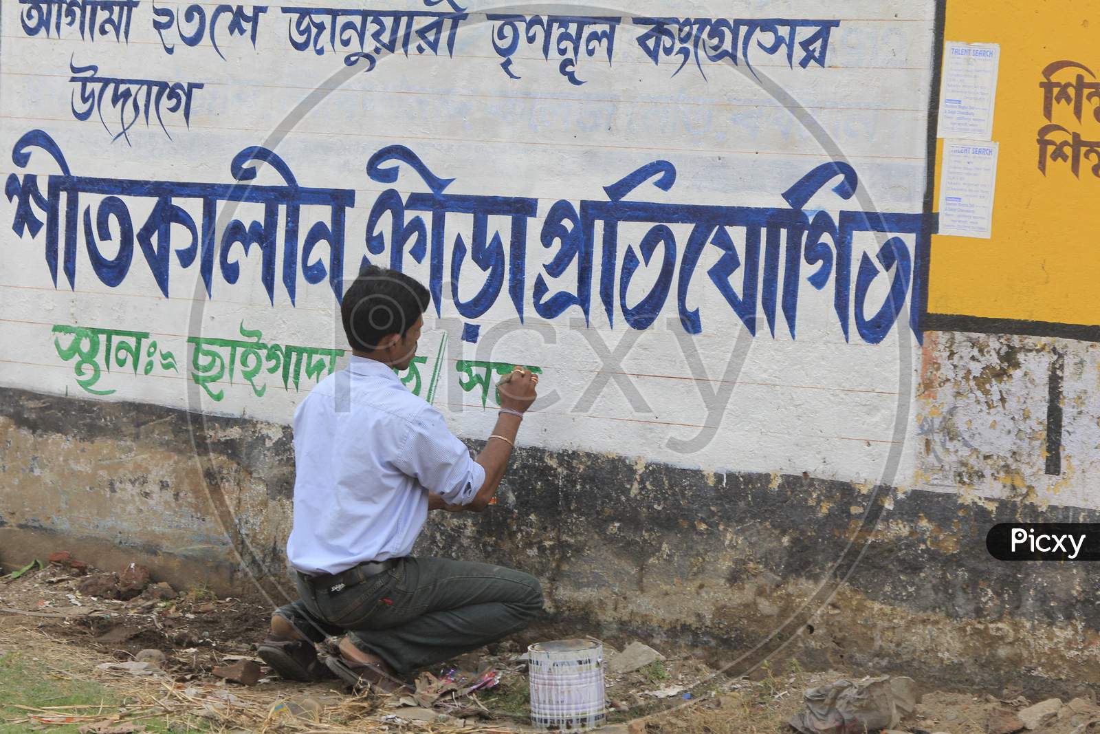 A Painter writing in Marati Language