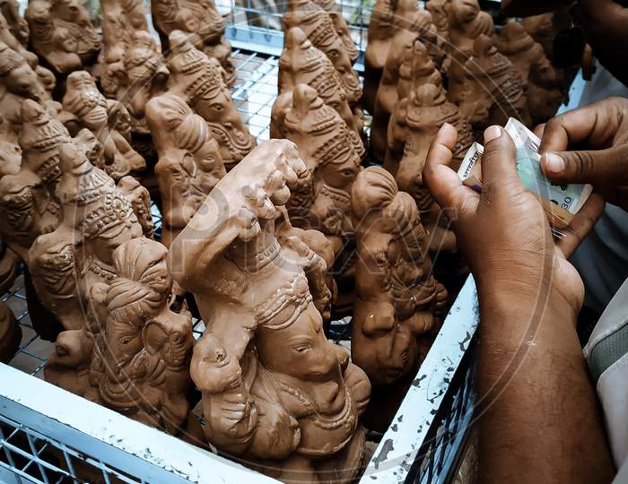 People purchasing Natural (Matti ) Ganesh Idol for Ganesh festival at dharmavaram