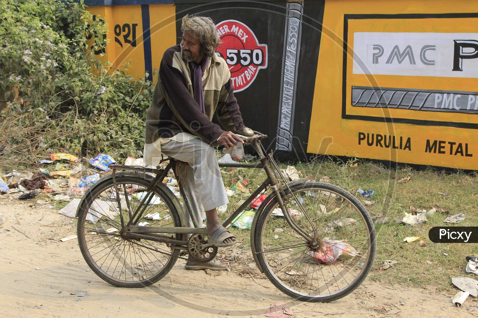 Indian Man on Bicycle in the Streets of Kolkata